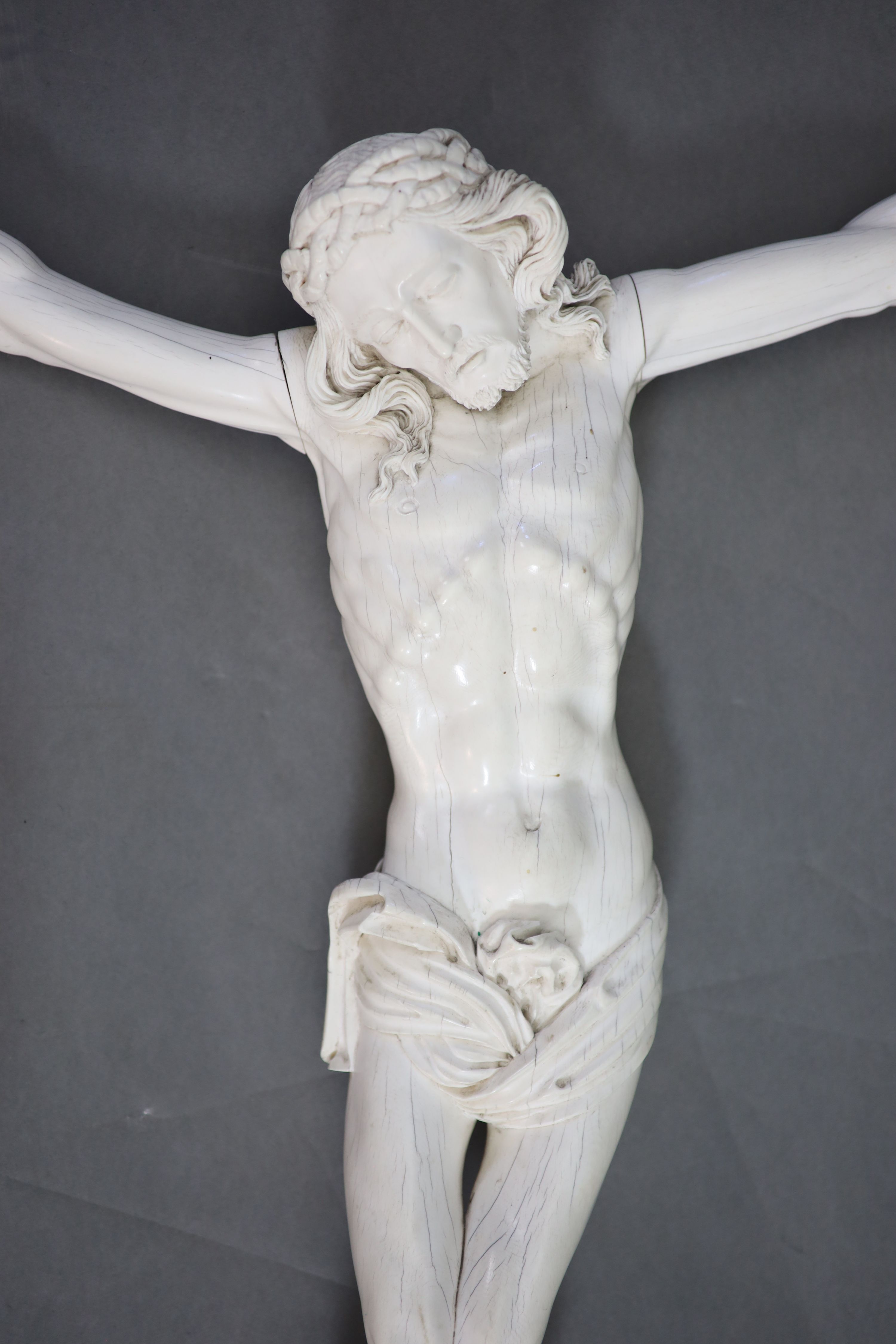 After Joseph Deutschmann (1717-1787) a very large German carved ivory Corpus Christi, 19th century 75cm wide, 75cm high.